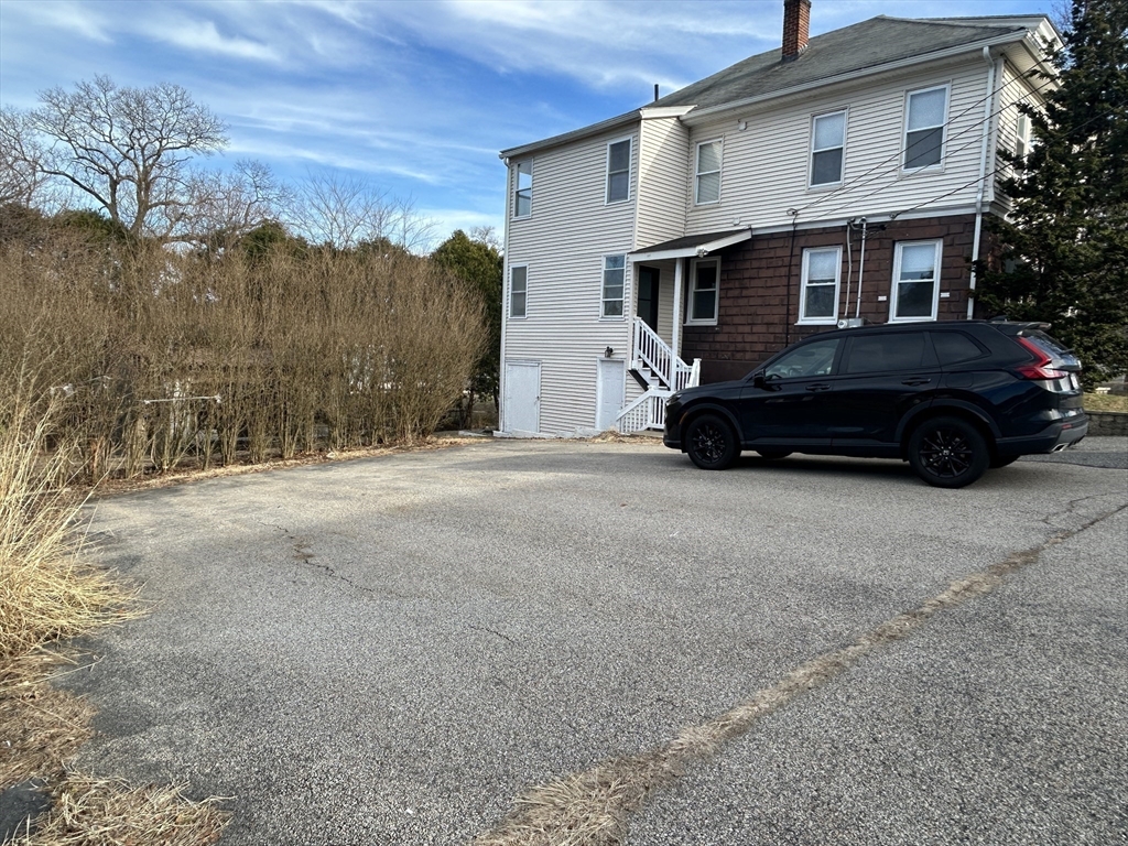 7 Wingate Street Shrewsbury, MA 01545 - Photo 20 of 21 a car parked in front of a house