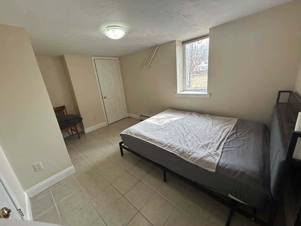 7 Wingate Street Shrewsbury, MA 01545 - Photo 9 of 21 a bedroom with a bed and a window