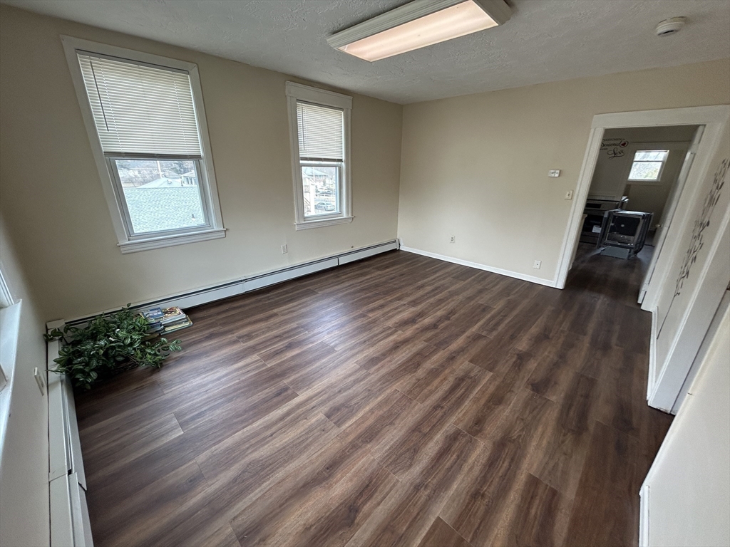 7 Wingate Street Shrewsbury, MA 01545 - Photo 10 of 21 wooden floor in an empty room with a window