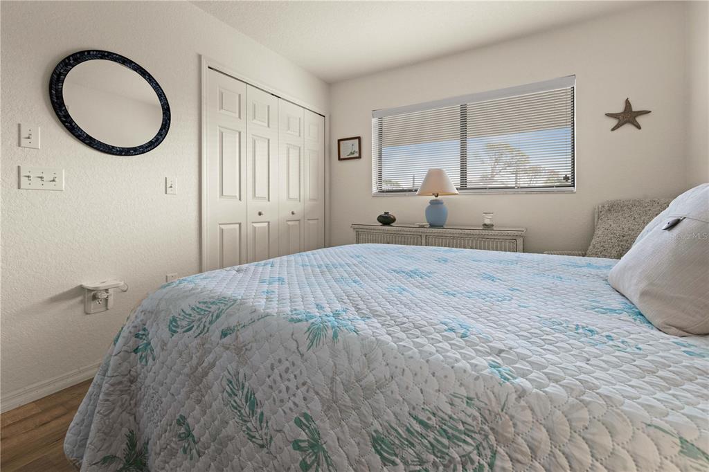 4260 Placida Road, Unit 14C Englewood, FL 34224 - Photo 18 of 37 a bedroom with a large bed and a window