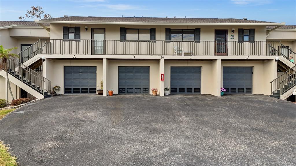 4260 Placida Road, Unit 14C Englewood, FL 34224 - Photo 23 of 37 a view of a building with a street