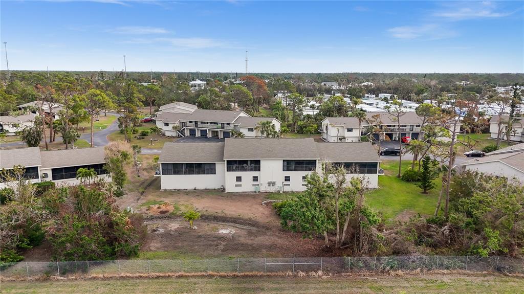 4260 Placida Road, Unit 14C Englewood, FL 34224 - Photo 26 of 37 an aerial view of multiple house