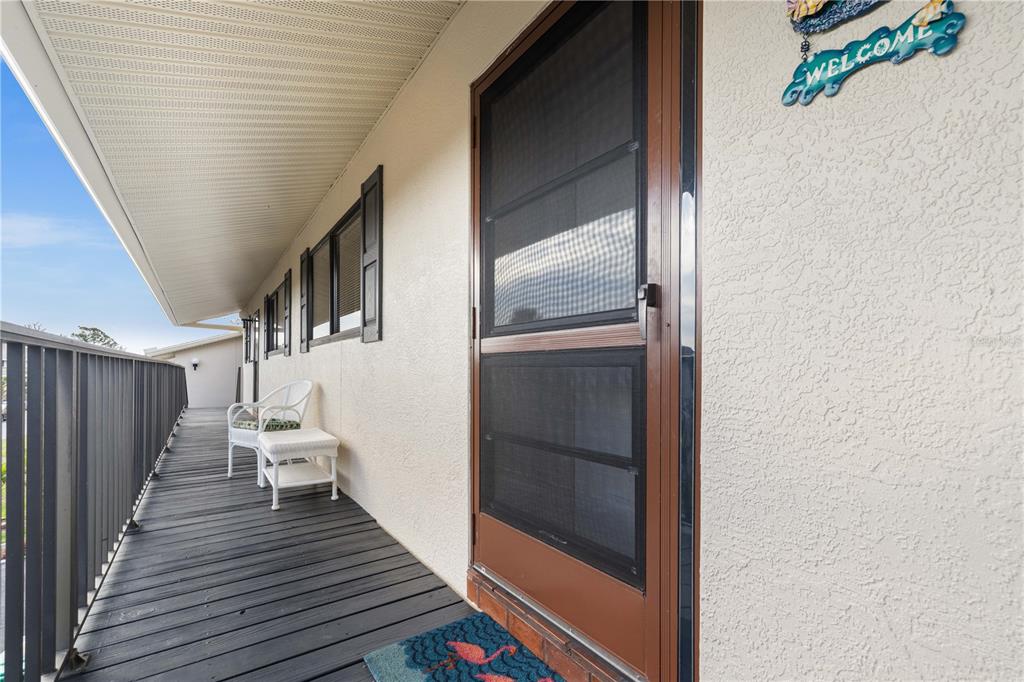4260 Placida Road, Unit 14C Englewood, FL 34224 - Photo 4 of 37 a view of outdoor space with wooden floor and staircase