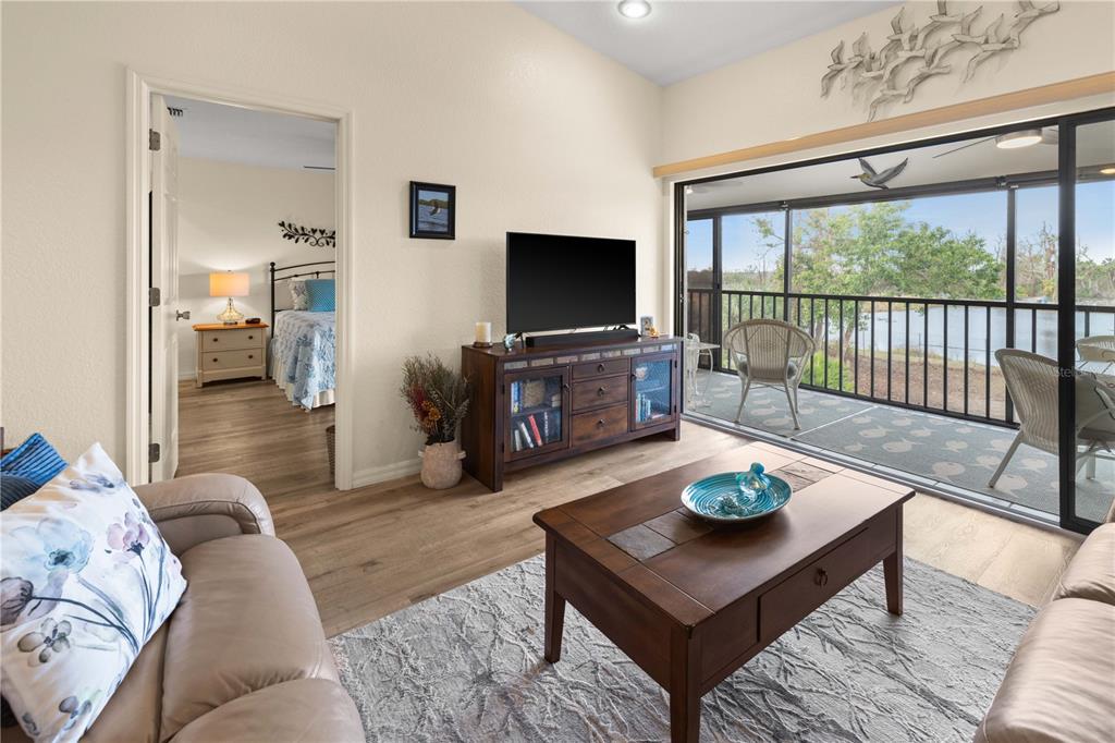 4260 Placida Road, Unit 14C Englewood, FL 34224 - Photo 9 of 37 a living room with furniture and a flat screen tv