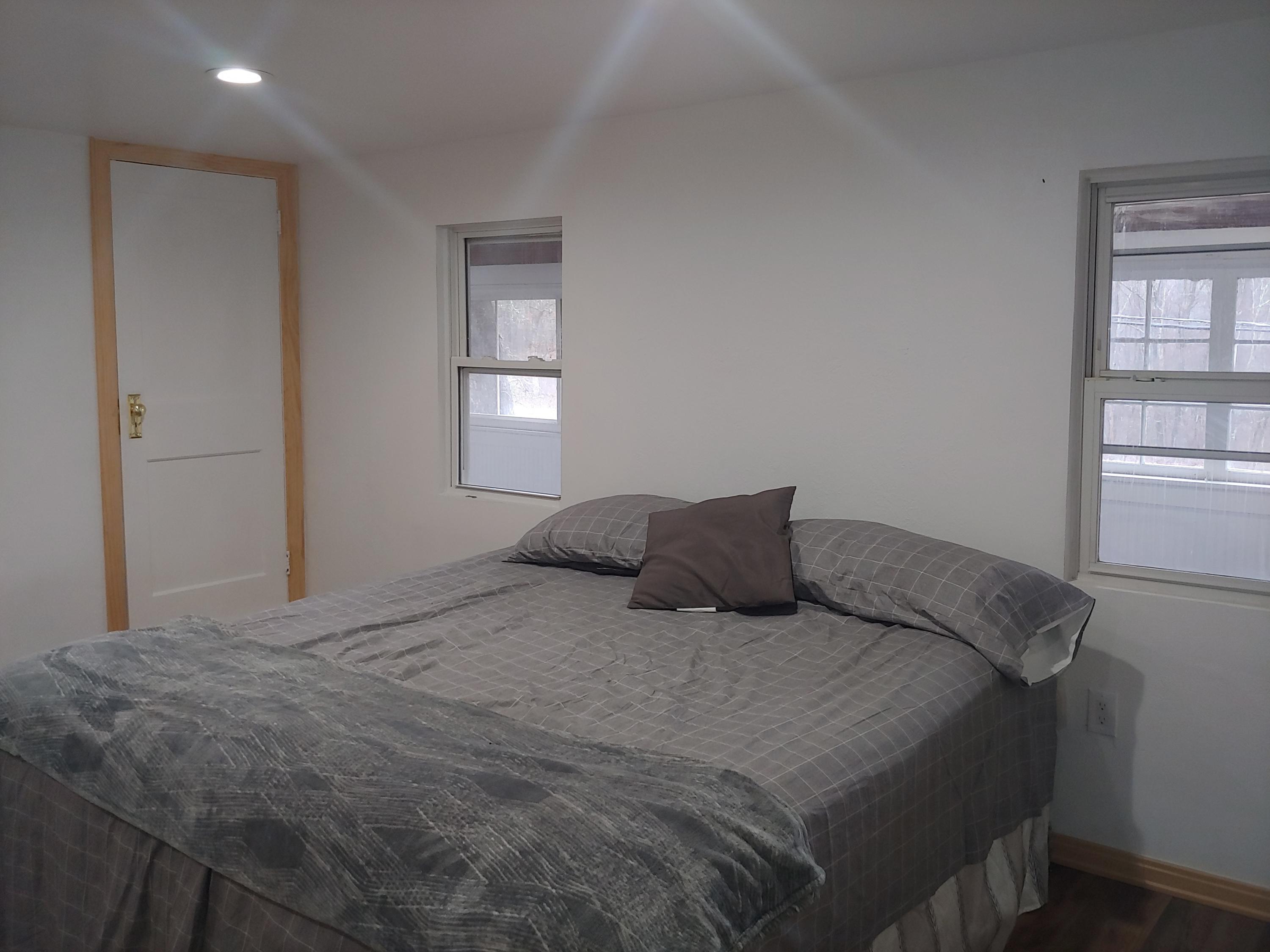 516 Red Rock Road Cresco, PA 18326 - Photo 21 of 47 a large bed sitting in a bedroom next to a window
