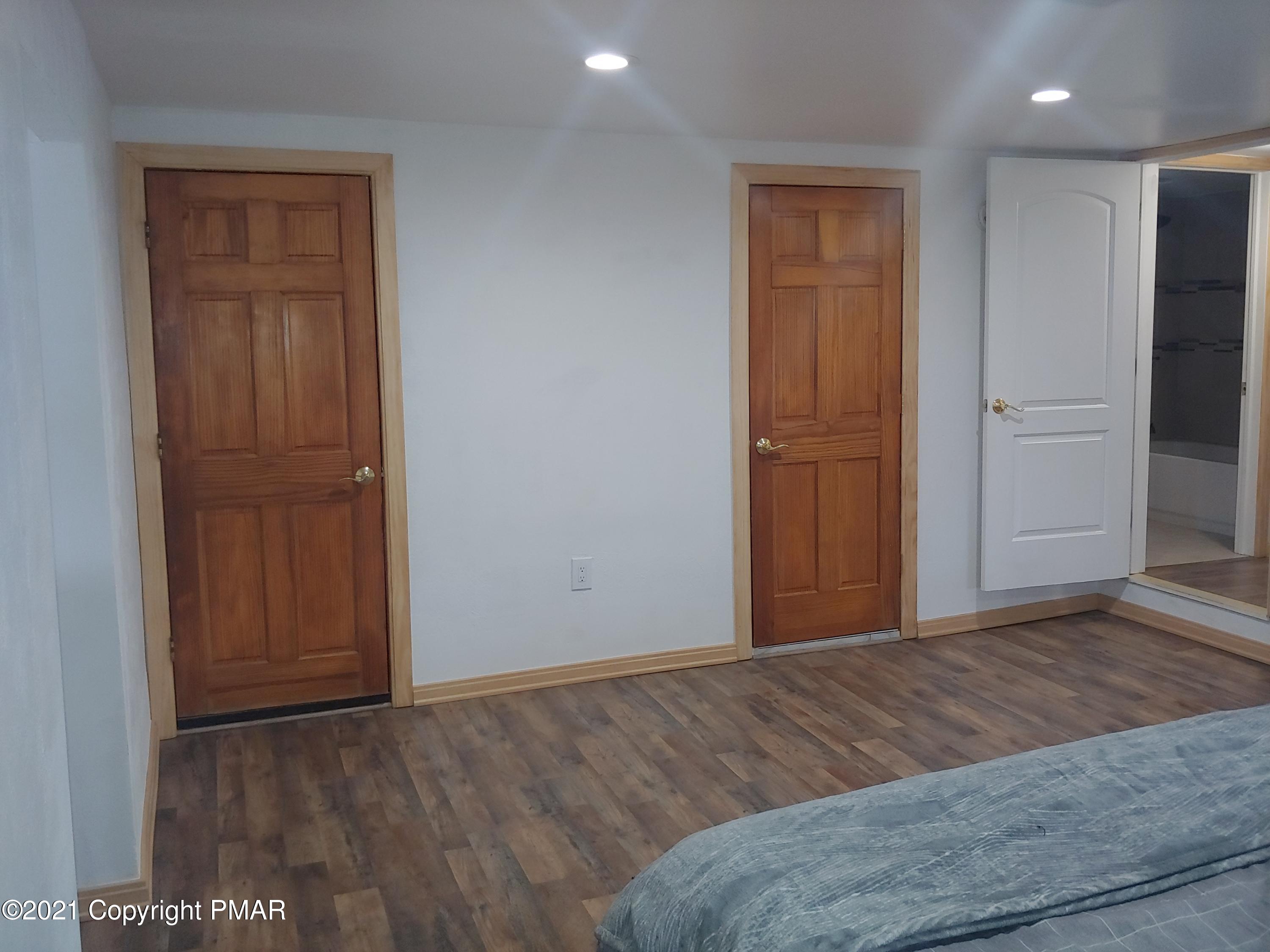 516 Red Rock Road Cresco, PA 18326 - Photo 22 of 47 a view of a livingroom with wooden floor and closet