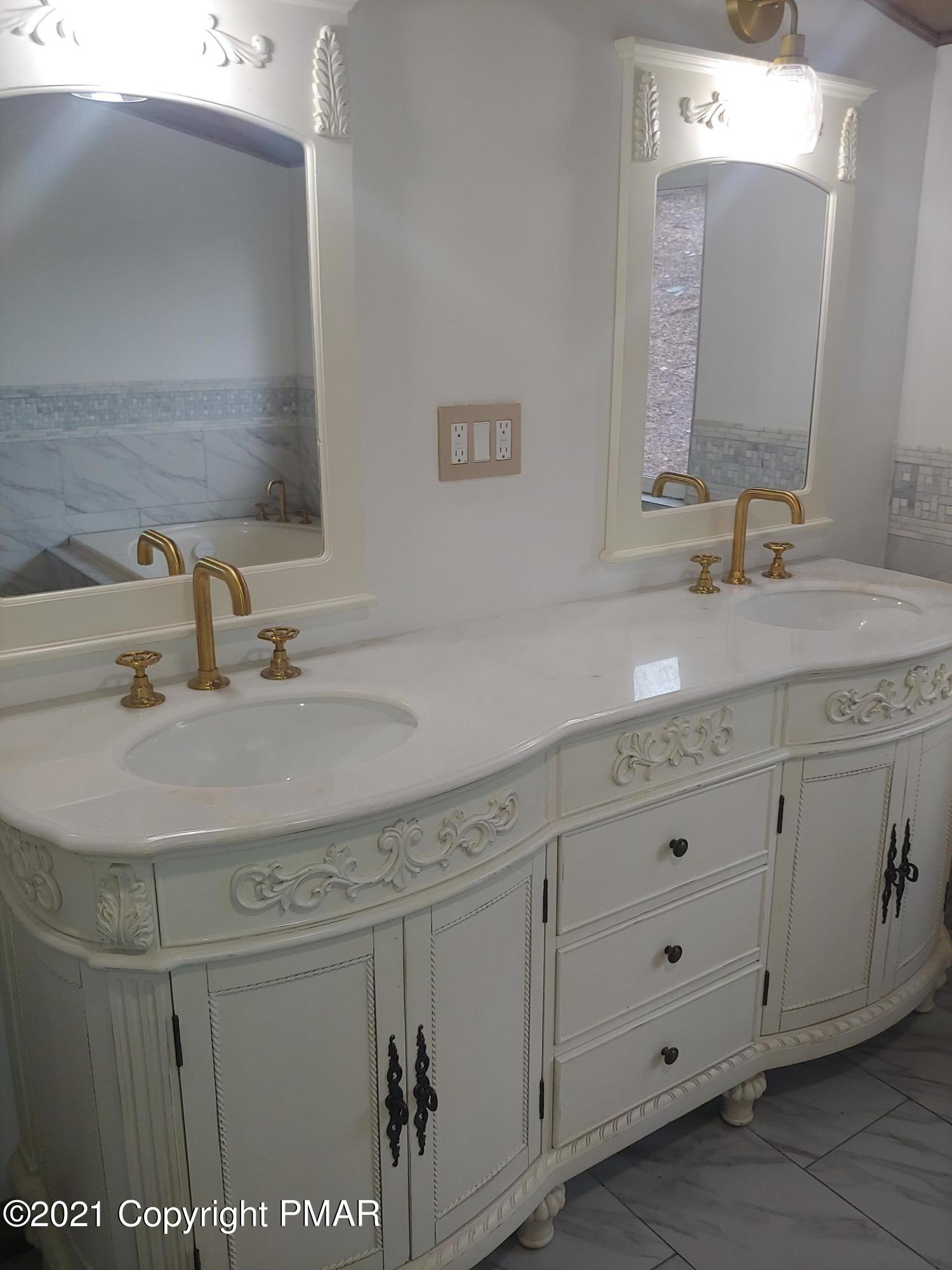 516 Red Rock Road Cresco, PA 18326 - Photo 26 of 47 a bathroom with a sink and a mirror