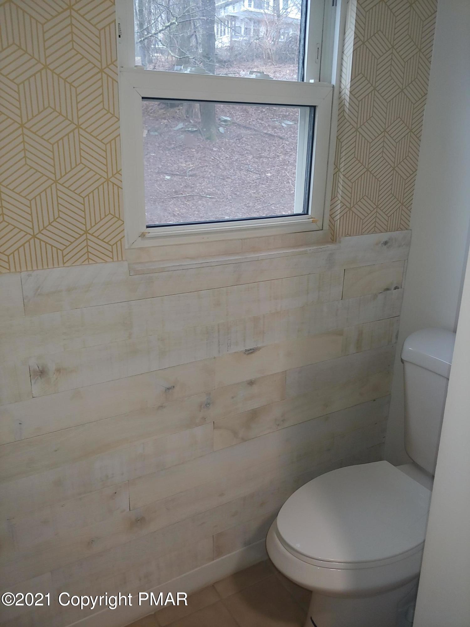 516 Red Rock Road Cresco, PA 18326 - Photo 34 of 47 a white toilet sitting next to a shower