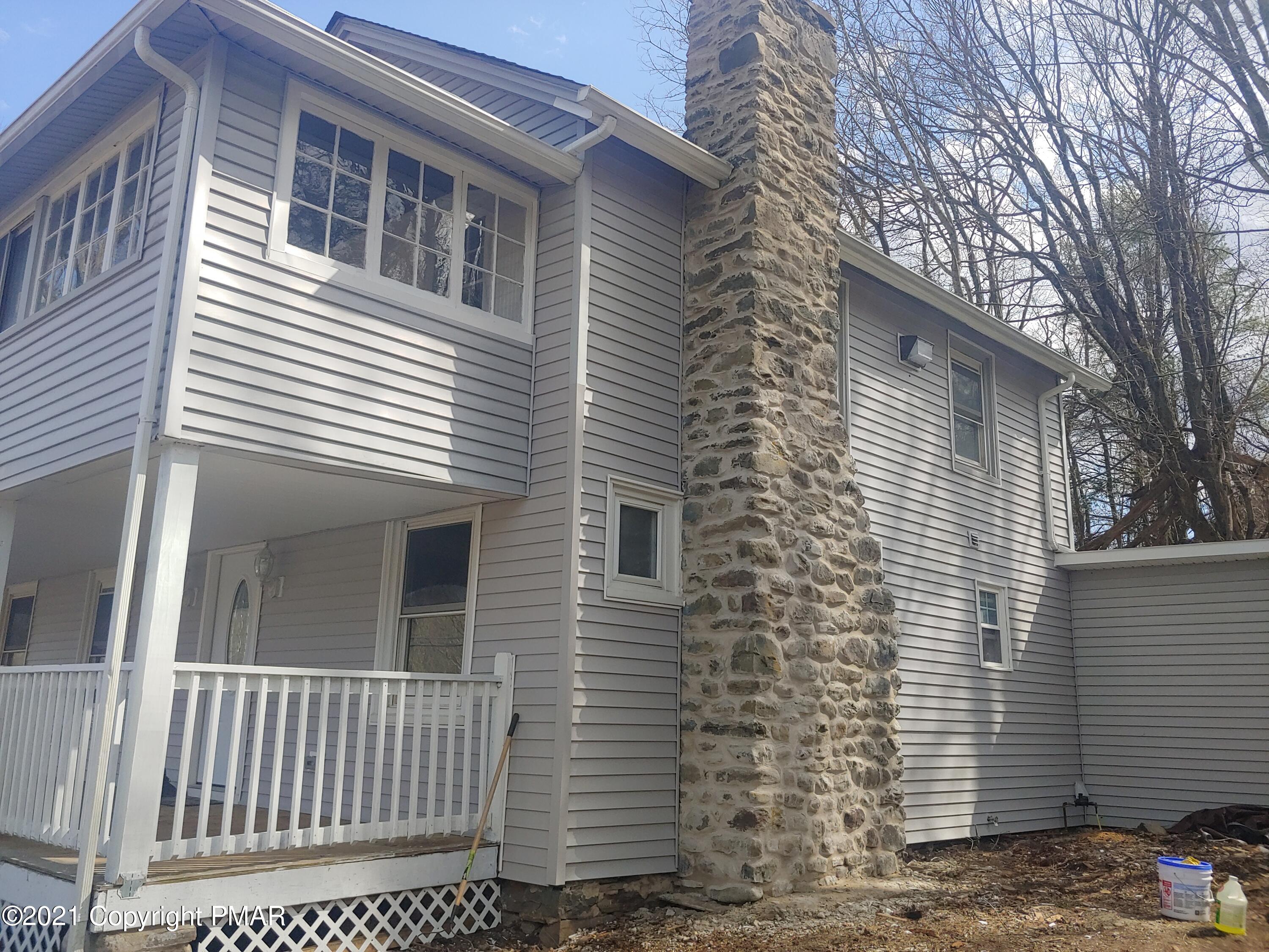 516 Red Rock Road Cresco, PA 18326 - Photo 46 of 47 a view of a house with a yard