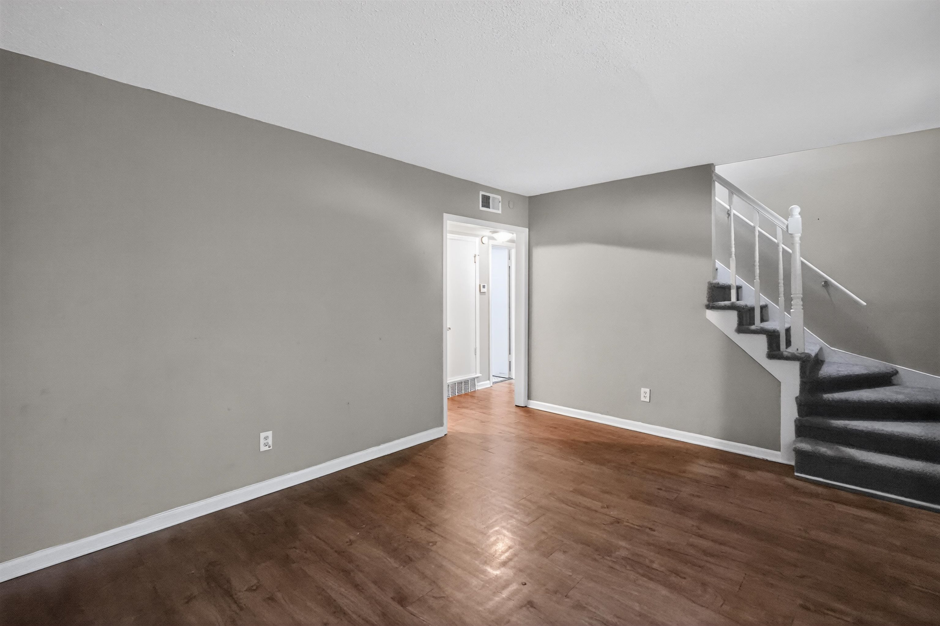 5124 Gill Road Memphis, TN 38109 - Photo 15 of 33 Interior space featuring wood-finish flooring, light gray wall paint, and white baseboards
