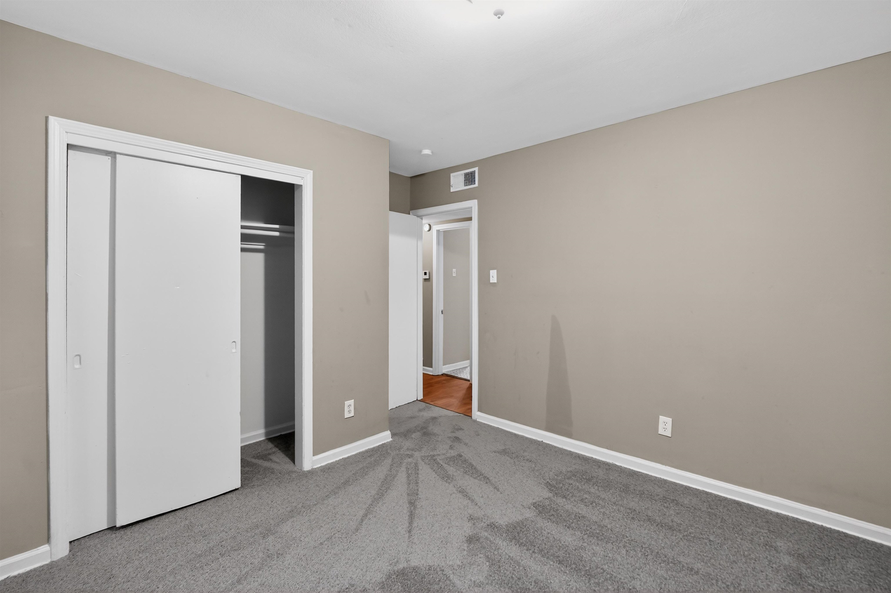 5124 Gill Road Memphis, TN 38109 - Photo 20 of 33 Bedroom with neutral wall paint and grey carpeting