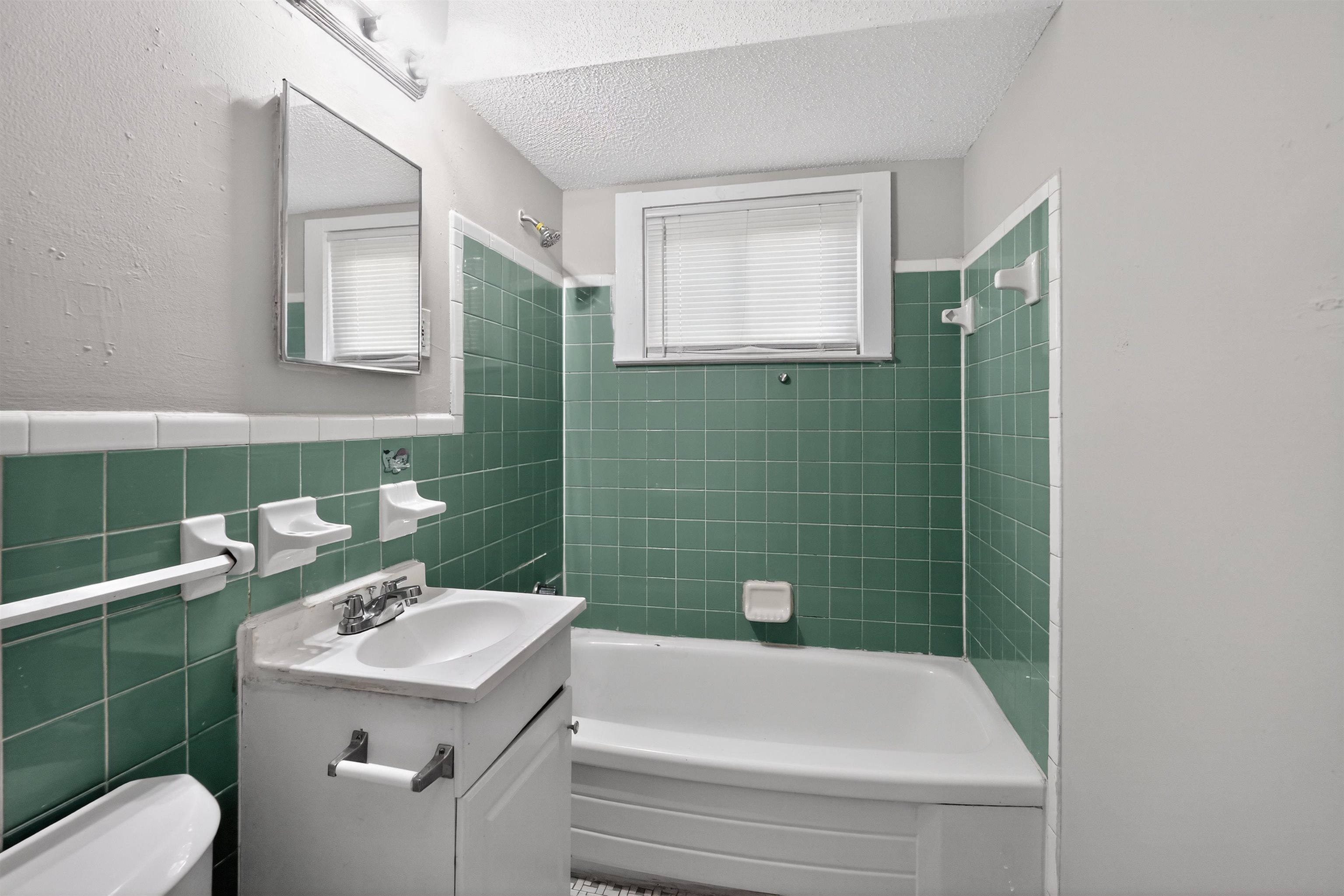 5124 Gill Road Memphis, TN 38109 - Photo 25 of 33 Bathroom featuring a white vanity with an integrated sink and chrome fixtures