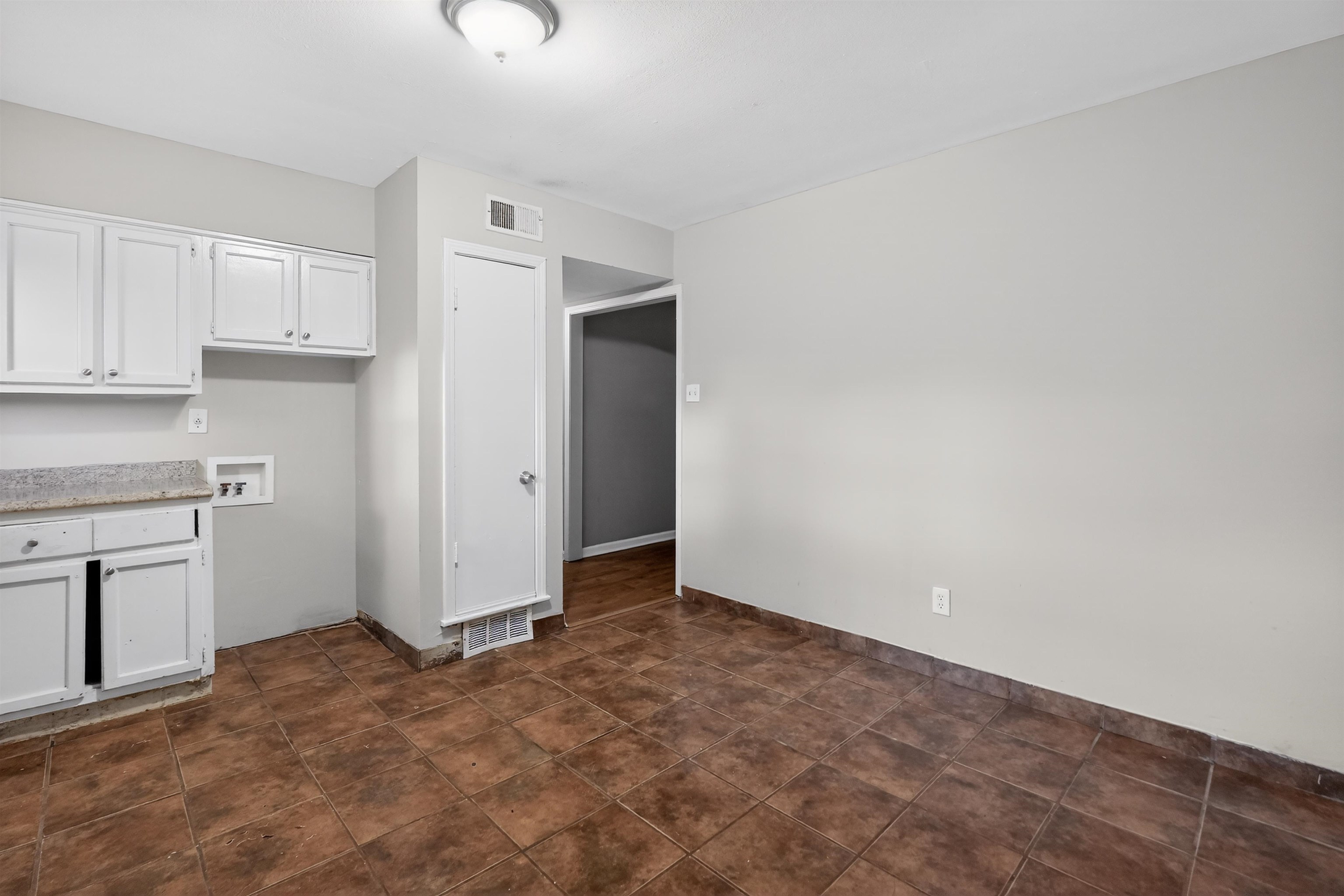 5124 Gill Road Memphis, TN 38109 - Photo 31 of 33 Neutral wall colors and durable tile flooring provide a versatile foundation