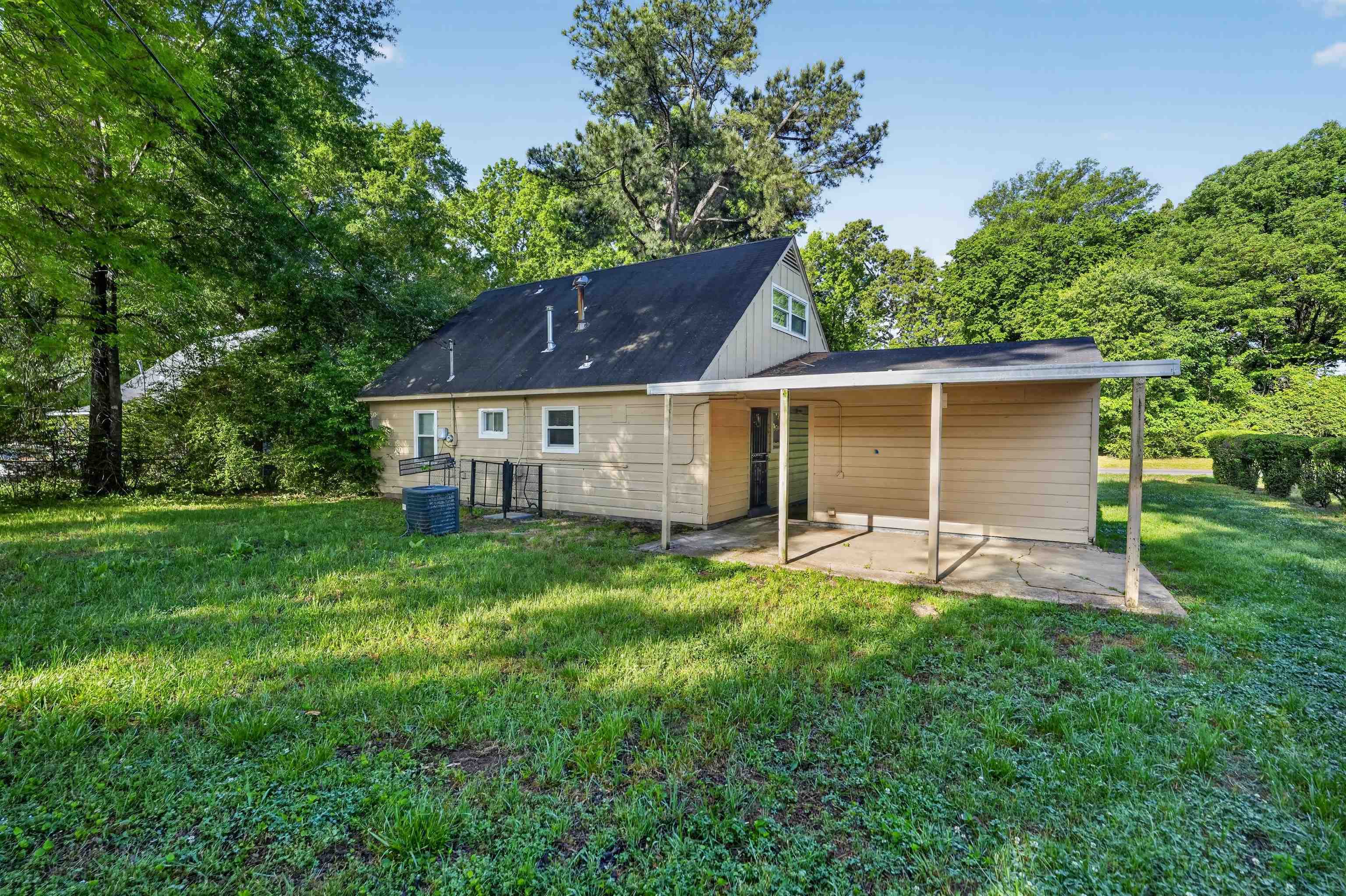 5124 Gill Road Memphis, TN 38109 - Photo 8 of 33 Expansive grassy yard with mature perimeter trees