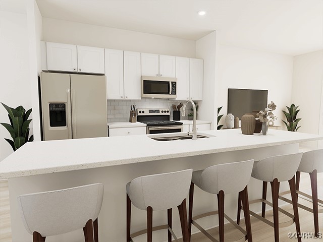 207 Whiteside Road Sandston, VA 23150 - Photo 4 of 19 a kitchen with a table chairs refrigerator and microwave