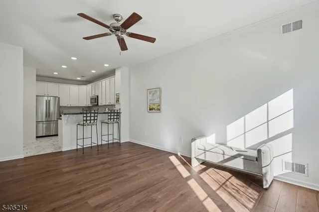 a view of kitchen with furniture and wooden floor