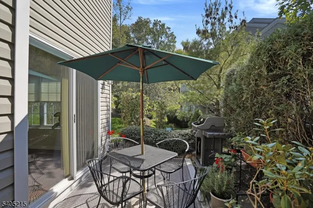 an outdoor space with furniture and umbrella