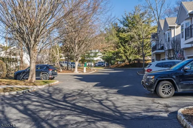 a view of street with parked cars