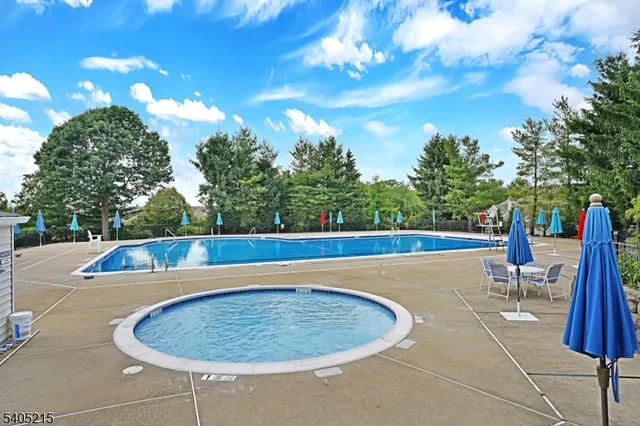 a view of a swimming pool with a sitting space