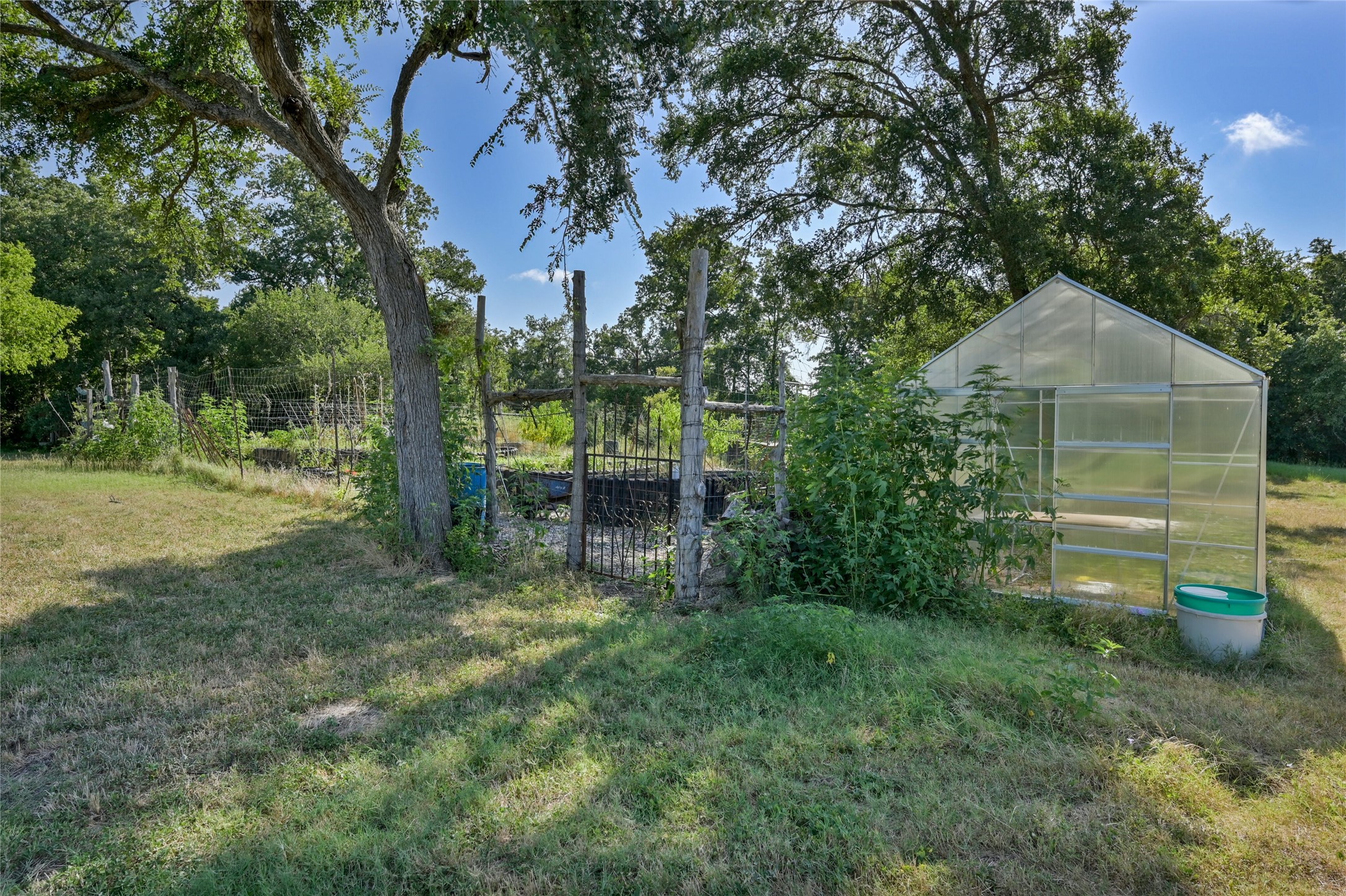 681 County Road 474 Elgin, TX 78621 - Photo 20 of 37 a view of a chair and table in the yard