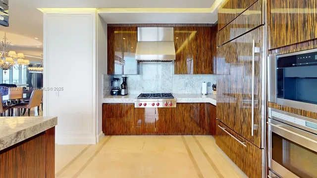 a bed room with furniture and a chandelier