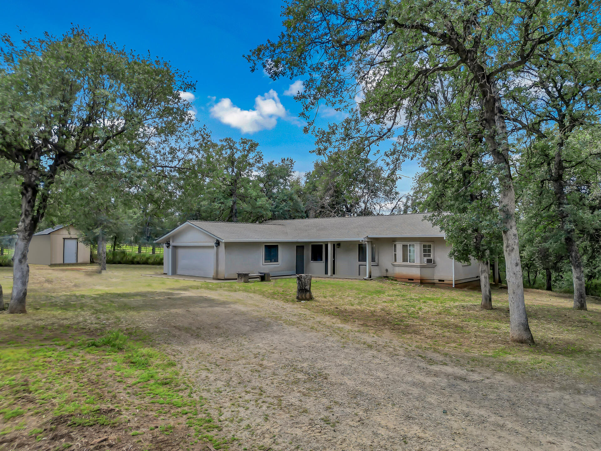 18080 Benson Road Cottonwood, CA 96022 - Photo 2 of 54 a front view of a house with a yard