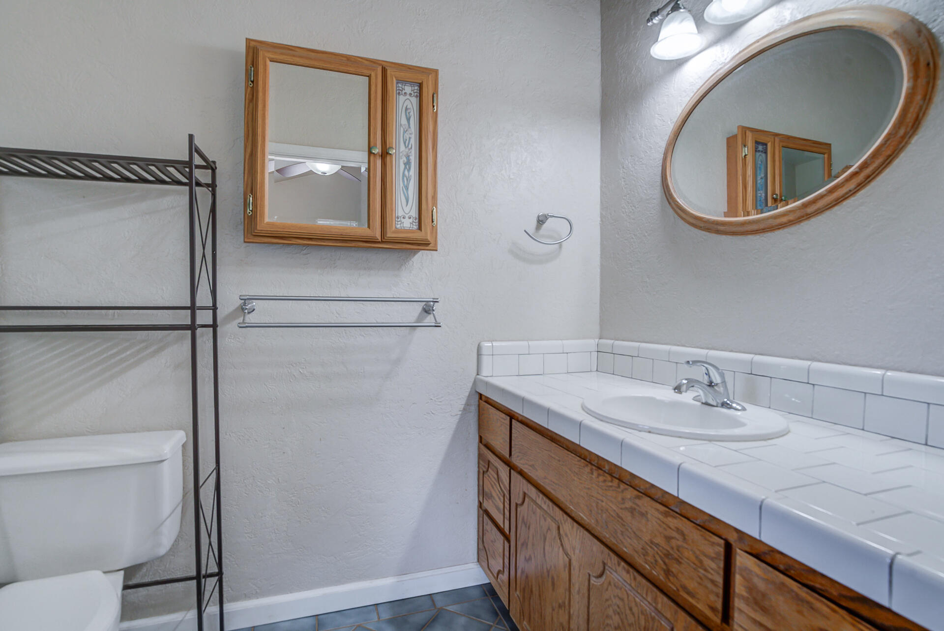 18080 Benson Road Cottonwood, CA 96022 - Photo 28 of 54 a bathroom with a sink and a mirror