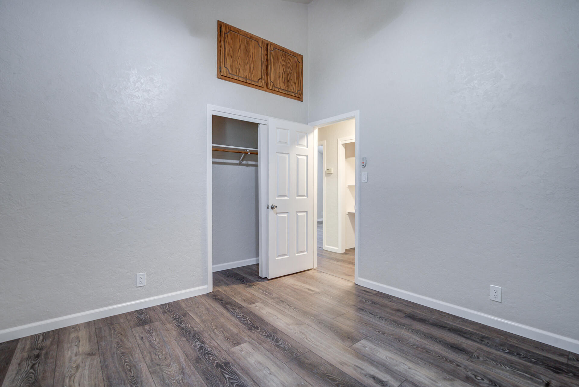 18080 Benson Road Cottonwood, CA 96022 - Photo 30 of 54 a view of an empty room with wooden floor and a window