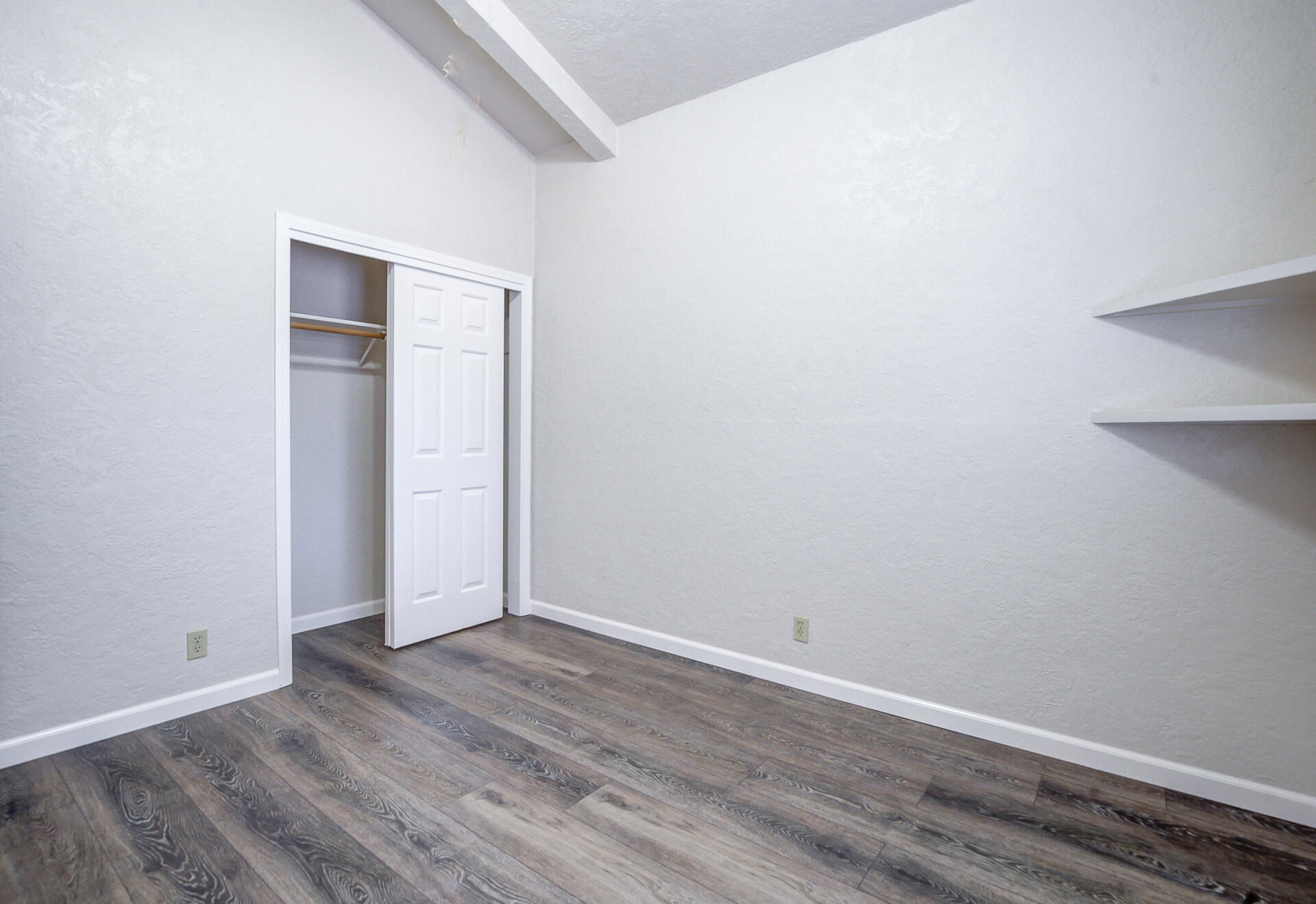 18080 Benson Road Cottonwood, CA 96022 - Photo 33 of 54 a view of an empty room with wooden floor and closet
