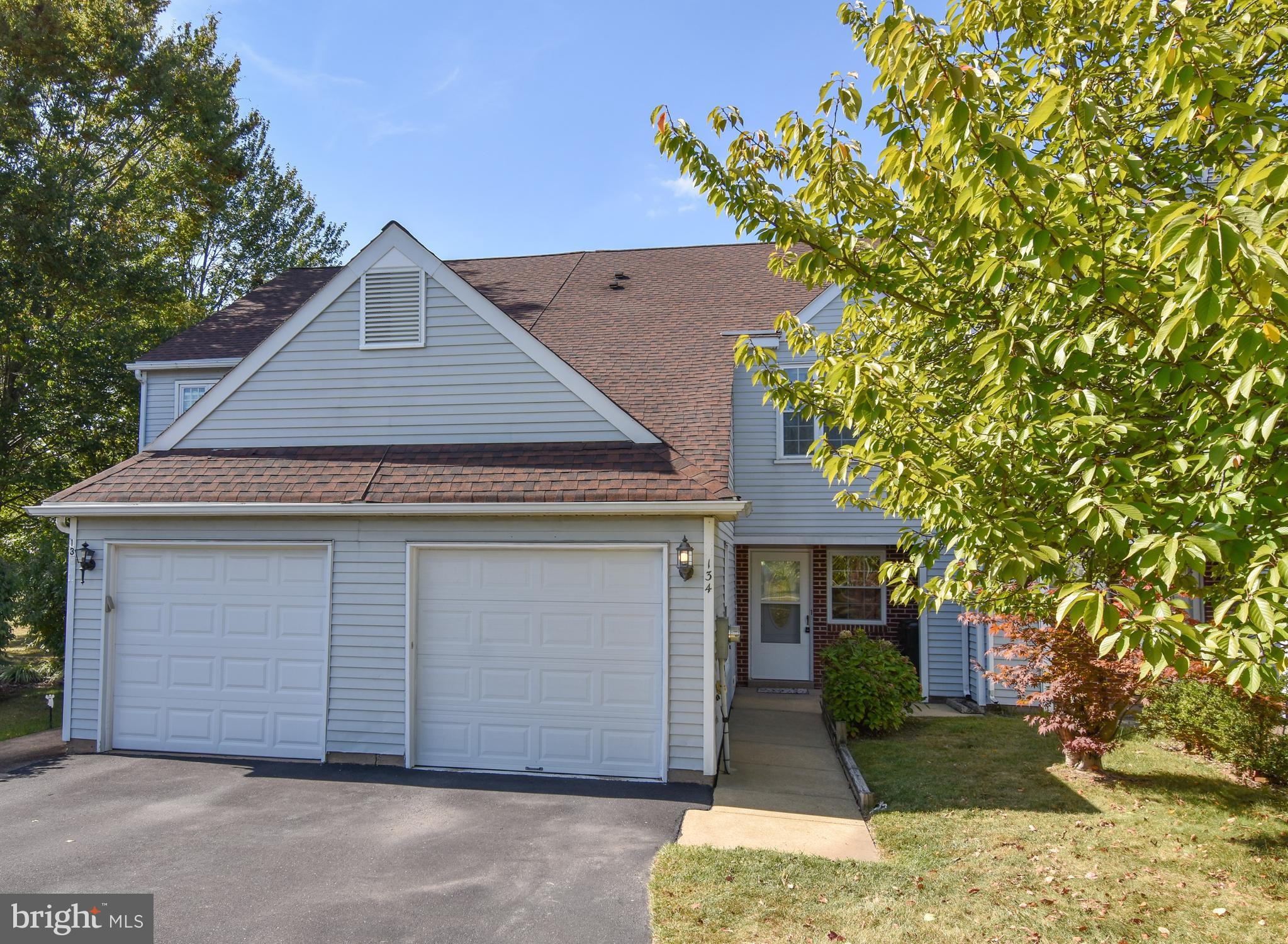 a front view of a house with a garage