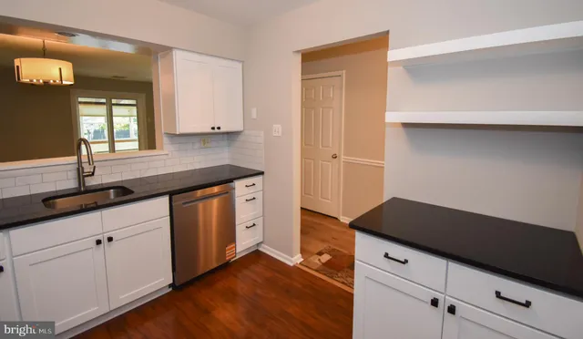 a kitchen with a sink and cabinets