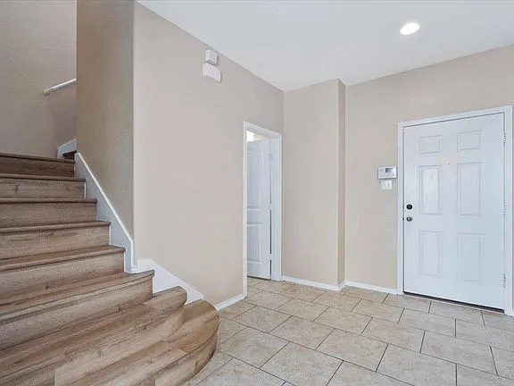 a view of an entryway with staircase