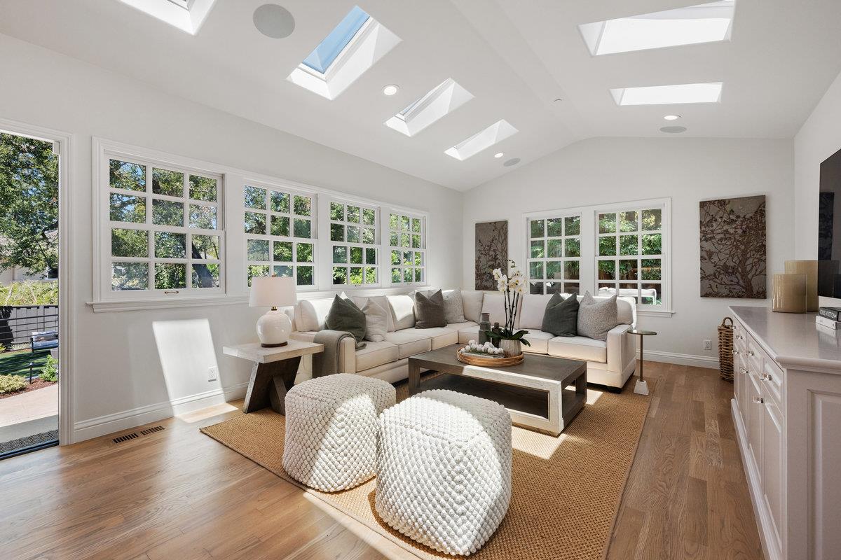 130 Stonehedge Road Hillsborough, CA 94010 - Photo 13 of 32 a living room with furniture floor to ceiling window and wooden floor