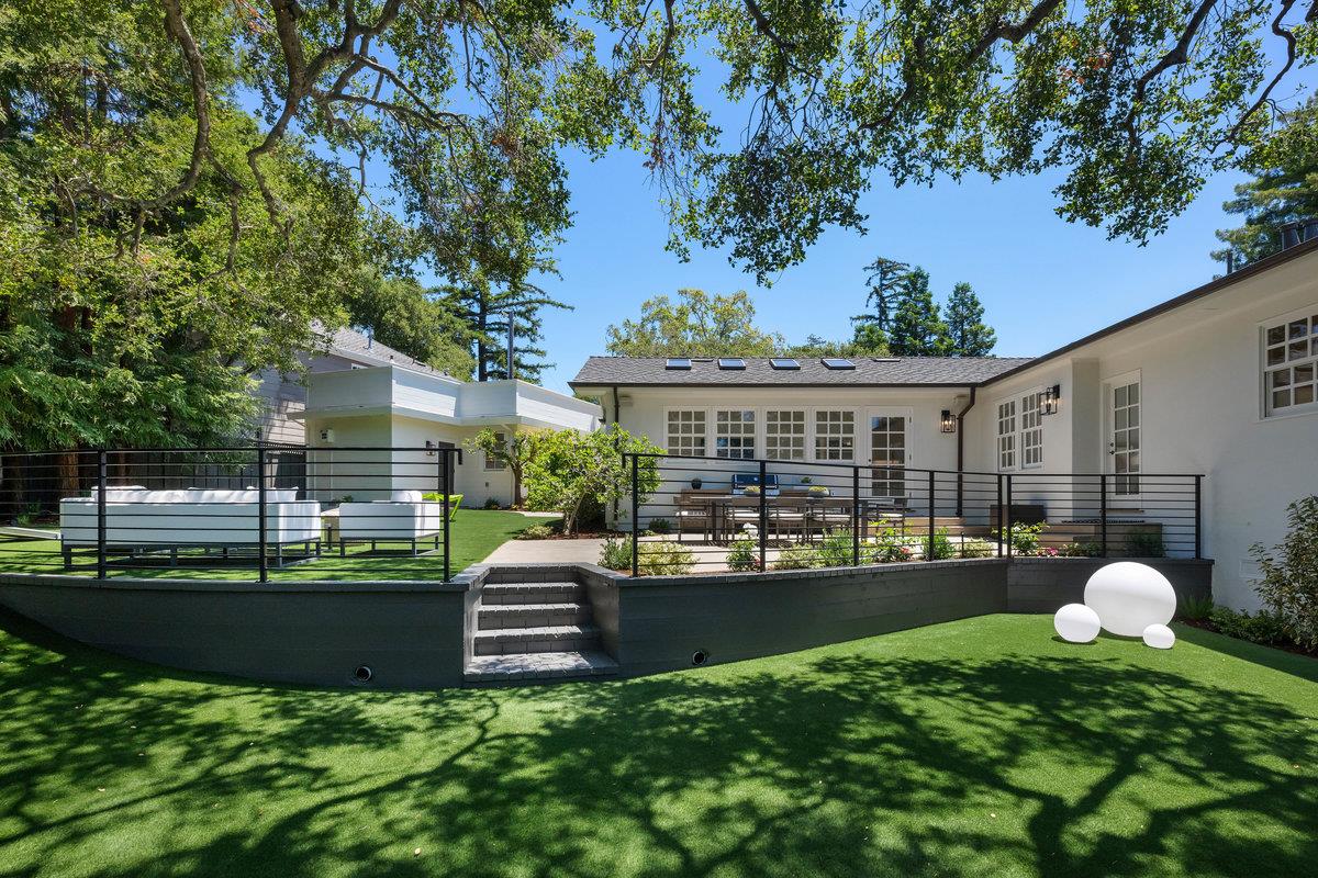 130 Stonehedge Road Hillsborough, CA 94010 - Photo 23 of 32 a view of a house with a backyard and a patio