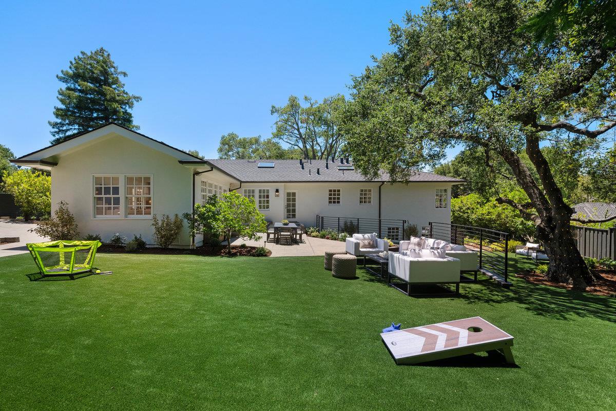 130 Stonehedge Road Hillsborough, CA 94010 - Photo 24 of 32 a backyard of a house with table and chairs
