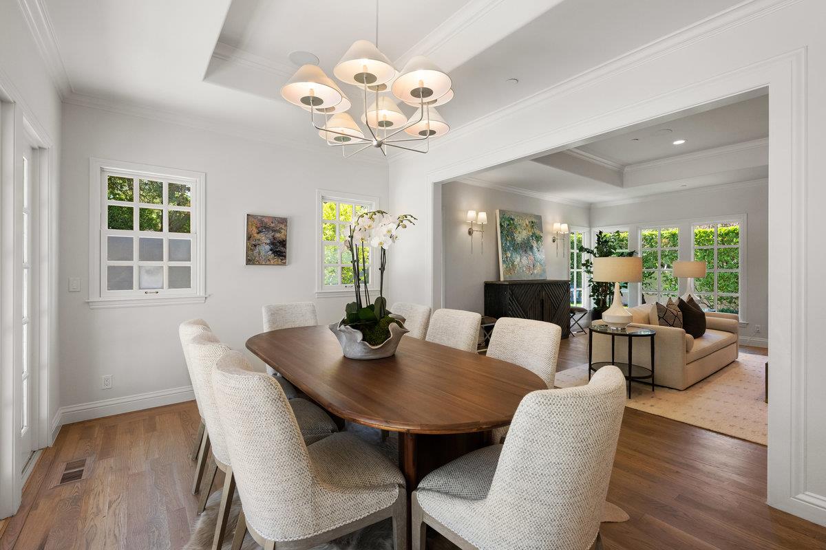130 Stonehedge Road Hillsborough, CA 94010 - Photo 6 of 32 a view of a dining room with furniture wooden floor and chandelier