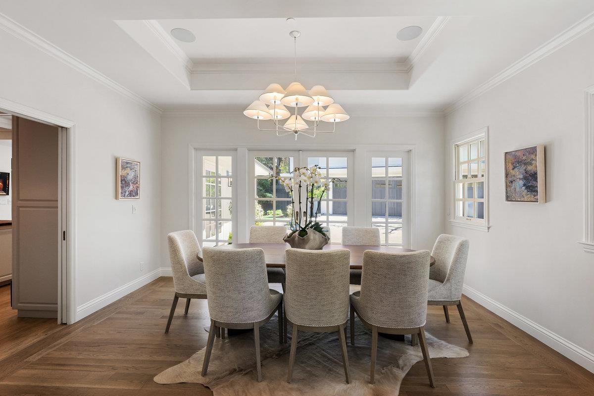 130 Stonehedge Road Hillsborough, CA 94010 - Photo 7 of 32 a view of a dining room with furniture wooden floor and chandelier