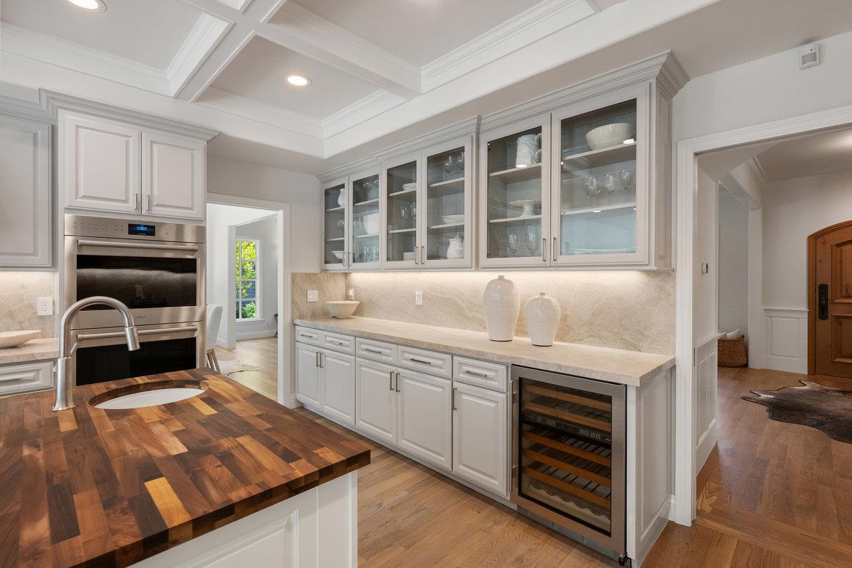 130 Stonehedge Road Hillsborough, CA 94010 - Photo 10 of 32 a kitchen with stainless steel appliances granite countertop a stove a sink and a microwave
