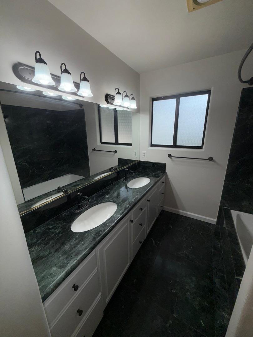 11585 McCarthy Road Carmel Valley, CA 93924 - Photo 42 of 52 a bathroom with a sink and a mirror