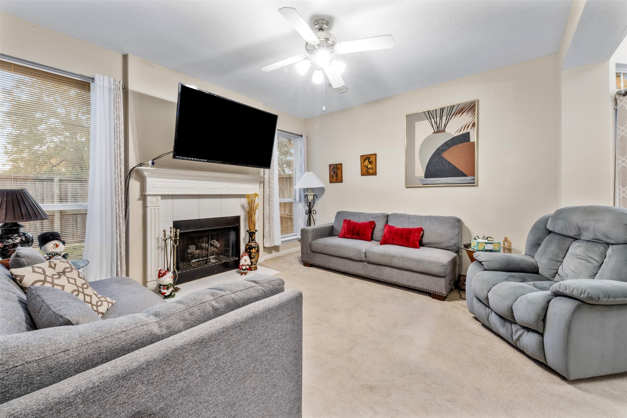 2334 Everest Way Kingwood, TX 77339 - Photo 6 of 29 Enjoy your afternoons in the living room next to a cozy fireplace.