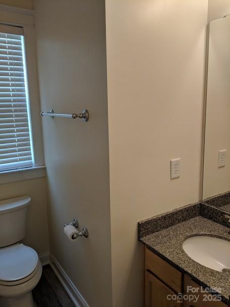 16535 Knox Run Road Huntersville, NC 28078 - Photo 13 of 15 a bathroom with a granite countertop toilet sink and mirror