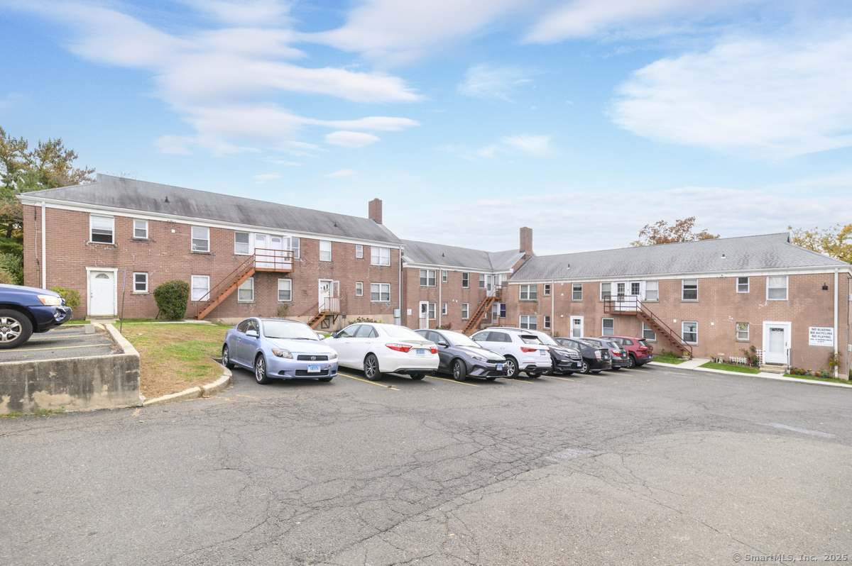1046 East Main Street, Unit 4 Stamford, CT 06902 - Photo 11 of 11 a view of yard with car parked