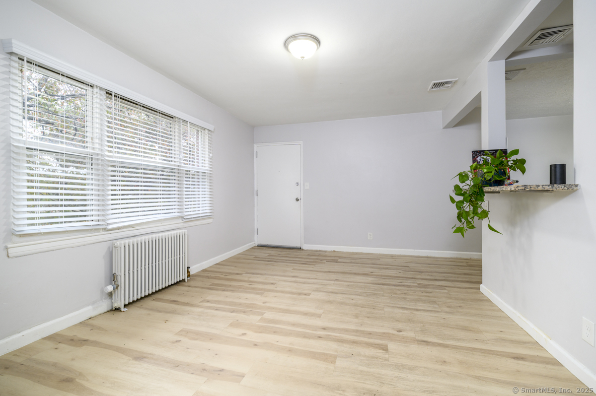 1046 East Main Street, Unit 4 Stamford, CT 06902 - Photo 7 of 11 a view of an empty room with a window