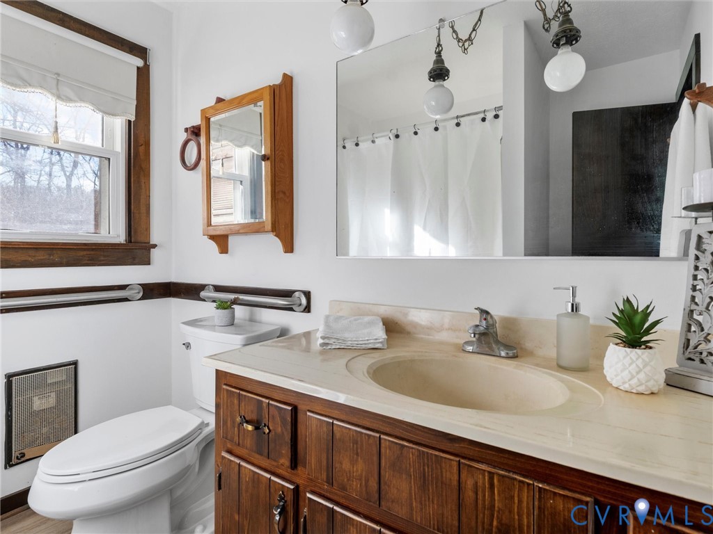 4905 Old Buckingham Road Powhatan, VA 23139 - Photo 17 of 50 a bathroom with a granite countertop sink mirror and toilet