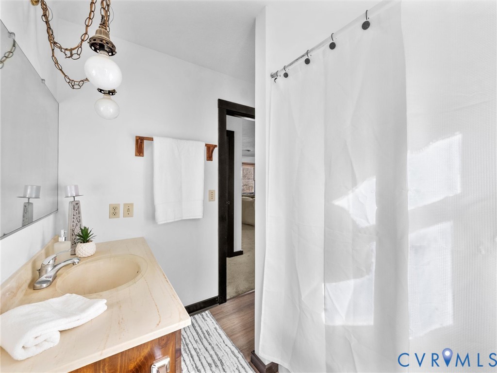 4905 Old Buckingham Road Powhatan, VA 23139 - Photo 18 of 50 a bathroom with a sink and a mirror