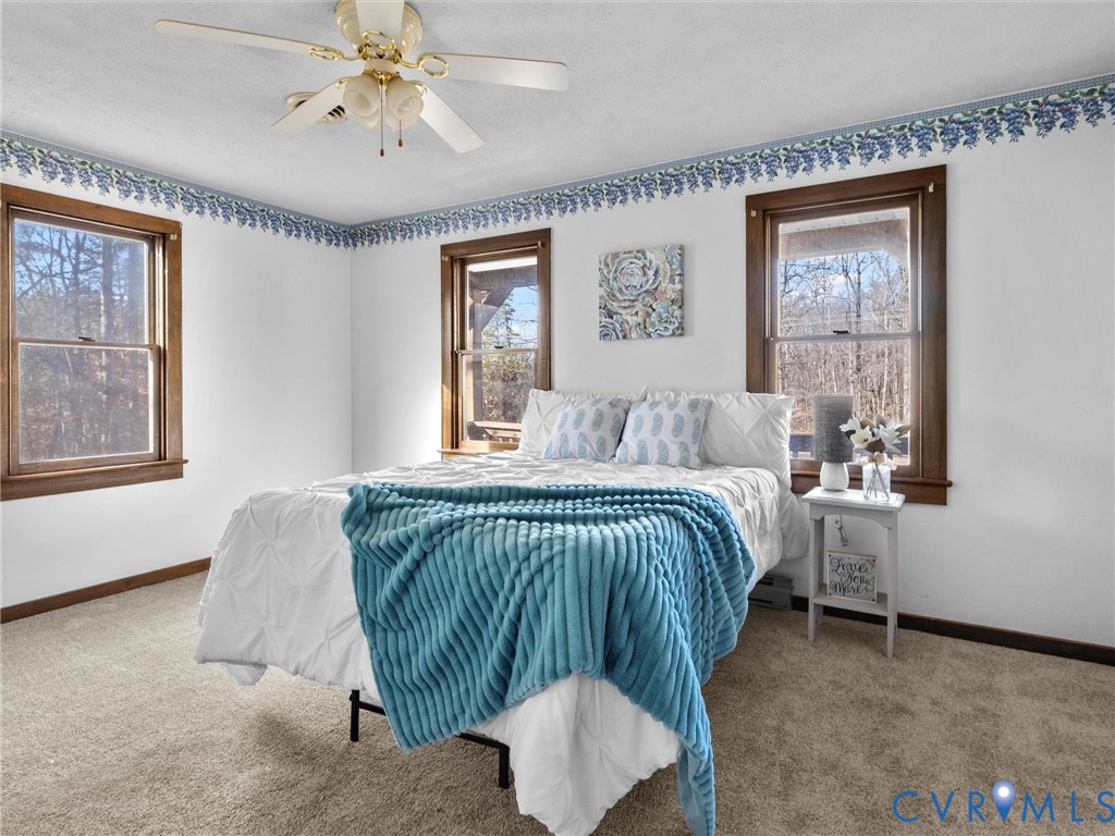 4905 Old Buckingham Road Powhatan, VA 23139 - Photo 19 of 50 a bedroom with a bed and window