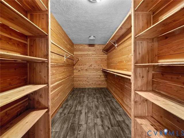 a view of a balcony with wooden floor and electronic appliances