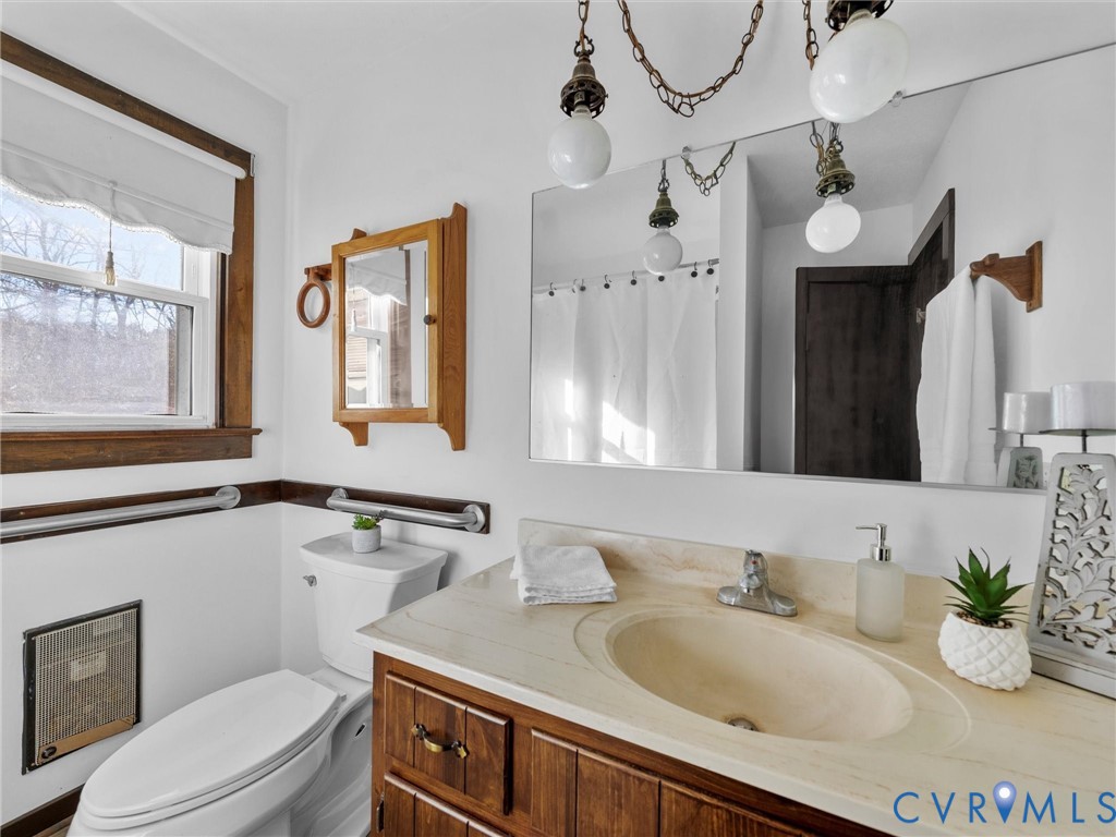 4905 Old Buckingham Road Powhatan, VA 23139 - Photo 46 of 50 a bathroom with a granite countertop sink mirror vanity and toilet