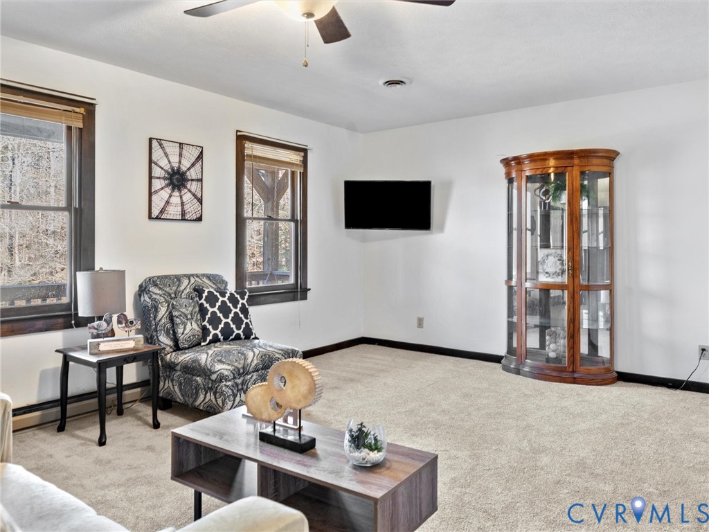 4905 Old Buckingham Road Powhatan, VA 23139 - Photo 9 of 50 a living room with furniture and a flat screen tv