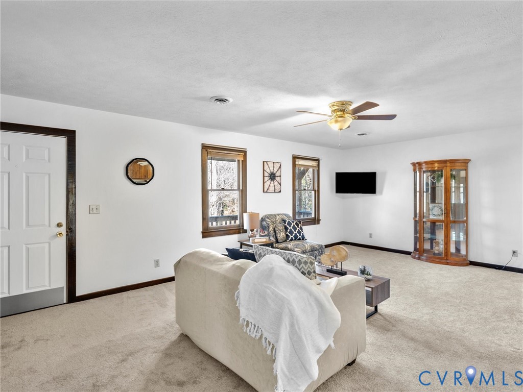 4905 Old Buckingham Road Powhatan, VA 23139 - Photo 10 of 50 a living room with furniture and a large window